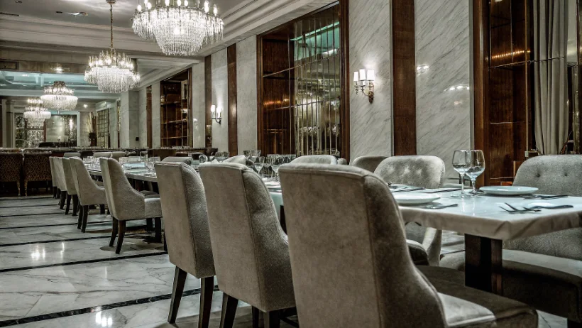 Luxurious casino restaurant with elegant table settings and ambient lighting