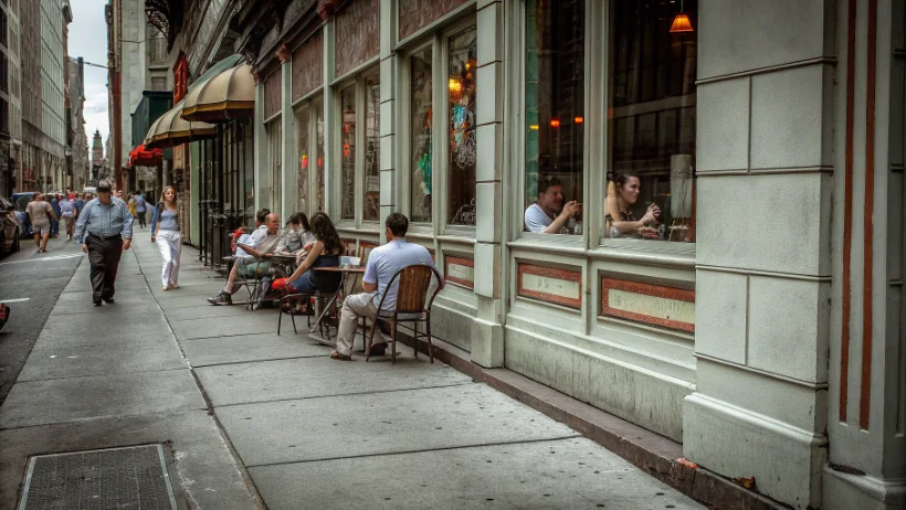 Philadelphia restaurant exterior with vibrant street dining atmosphere
